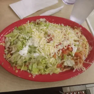 Cuatro Esquinas- there's a burrito, chimichanga, tamale &amp; enchilada under there somewhere....