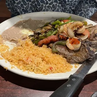 Steak and rice , beans , avocado