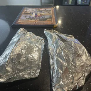two pieces of foil on a counter
