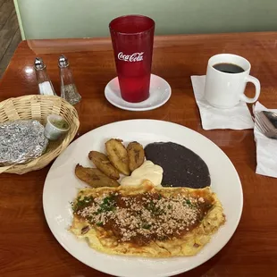 Omelette, plantains, retried black beans , Central American sour cream.