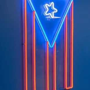 a neon sign on a wall