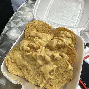 a plate of nachos with cheese