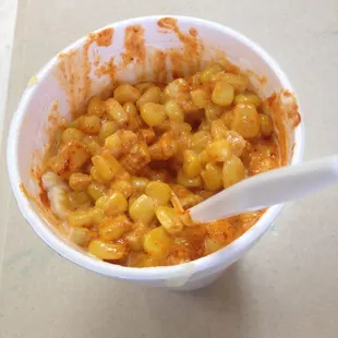 Large corn in a cup, has mayo, cheese, and chile!