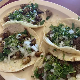 Pork and shredded beef tacos