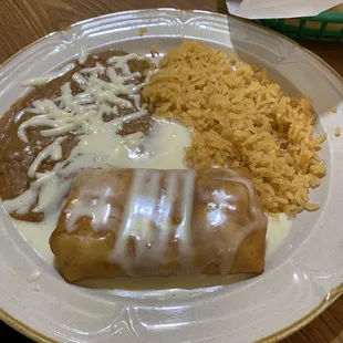 Lunch Chicken Chimichanga w/ Cheese Sauce... beans and rice are great too! Awesome Lunch Deals too!