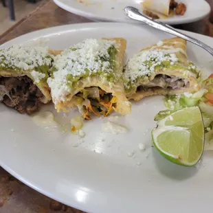 inside my quesadilla fritas. mushroom/ cheese , some kinda flower and cheese, and asada