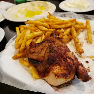 a plate of chicken and french fries