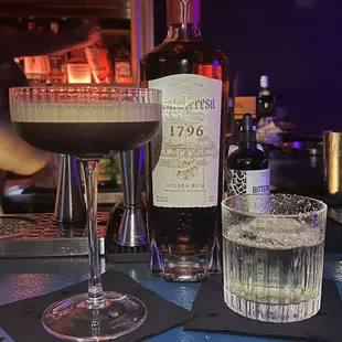 a bottle of liquor and a glass of liquor