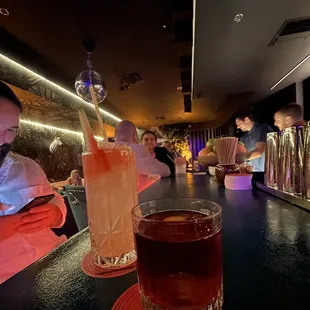 people sitting at a bar