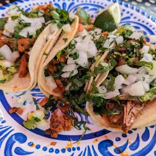 Tacos: chorizo, carnitas, and al pastor.