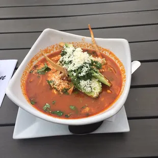 Absolutely delicious Chicken Tortilla Soup with avocado and cheese.