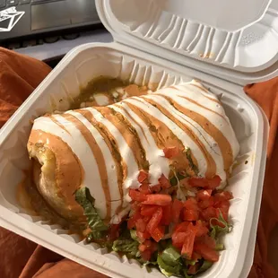 a meal in a styrofoam container