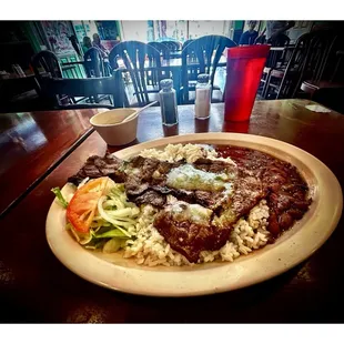 El Llano Restaurant. Specials 9.95$ !Ribeye Steak and Chicken with Beans Rice and Salad.Very Good Deals!  Great for Lunch! Cool! BYOB!