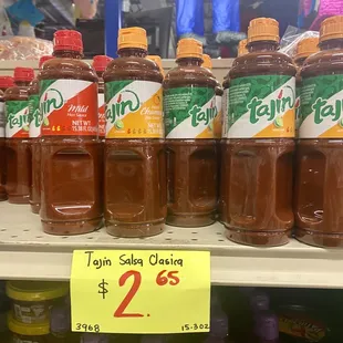a display of jars of jelly in a grocery store