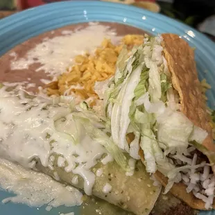 One beef Taco and one beef Enchilada with green sauce-add refried beans and rice. YES.