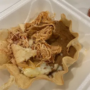 Taco &quot;salad&quot; minus any kind of veggies or guacamole. Literally a shell, beans, cheese, and chicken.