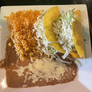 Two Tacos with Mexican Rice and Refried Beans.