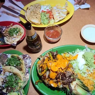 Carne asada street tacos, chicken street tacos, pineapple fajitas, chicken quesadilla and Modelo negra......