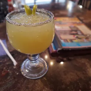 a margarita with a lime garnish