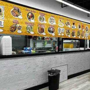 a restaurant counter with food on it