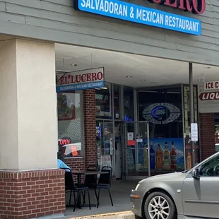 a car parked in front of a restaurant