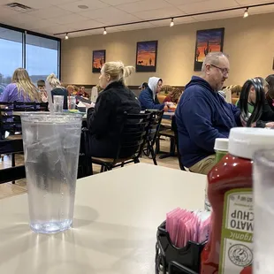 a restaurant with people sitting at tables