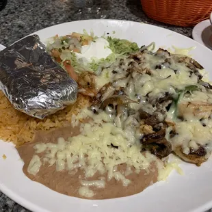 Under specialties. Armendos or something along those lines! Fantastic!!  Steak, chicken, shrimp and bacon with veggies