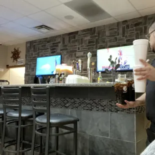 a woman holding a cup of coffee