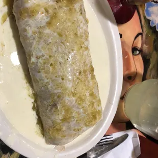 a person holding a burrito