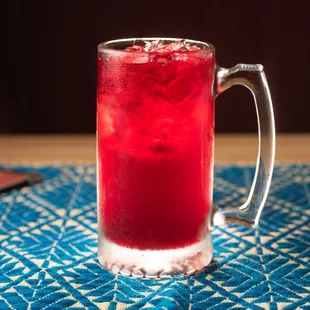 a glass of red drink