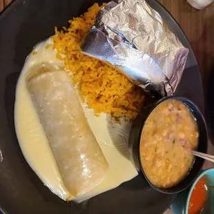 Combo-Chicken Enchilada, Chicken Taco, Rice and Charro Beans= $10.99