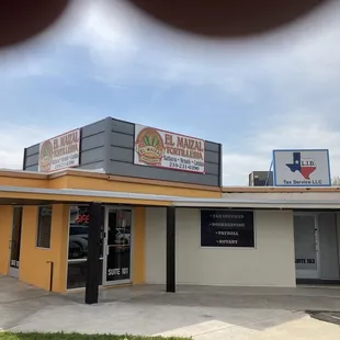 The front entrance zoom to the sign to see their main concept of the place