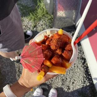 a person holding a bowl of food