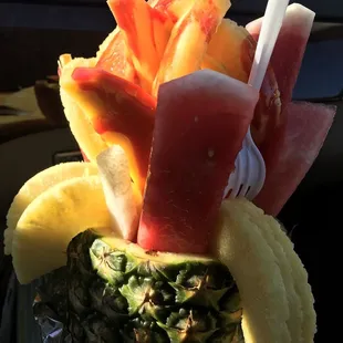 a pineapple, watermelon, and fruit