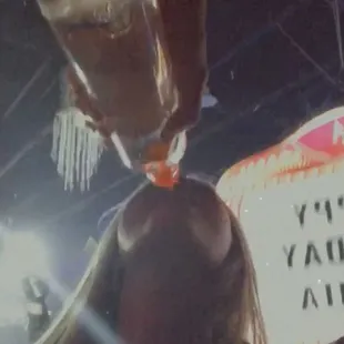 a woman drinking a drink