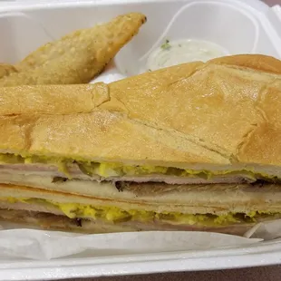 a sandwich in a styrofoam container