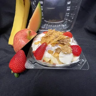a bowl of fruit and yogurt