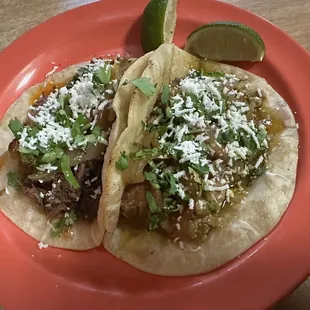 Pork taco with green sauce and Barbacoa taco