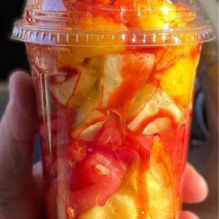 Fruit cup with watermelon, pineapple, cucumber, mango, cantaloupe, chamoy and chili (powder Lucas)