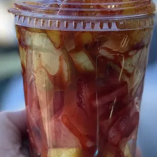 Fruit cup with watermelon, pineapple, cucumber, mango, cantaloupe, chamoy and chili (powder Lucas)