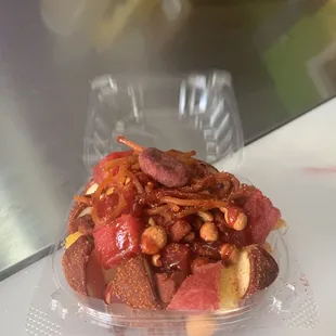 a clear plastic container of food