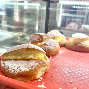 three pastries on a red tray