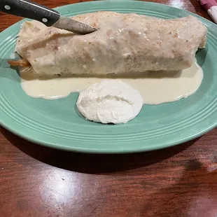 Super Burrito - it has steak, chicken, shrimp, Vegetables, jalapeños, and fries.