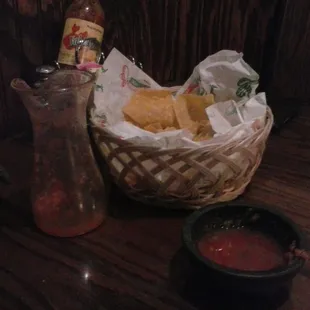 Complementary salsa and toasted chips before order. You pour the glass of salsa in small serving bowls.