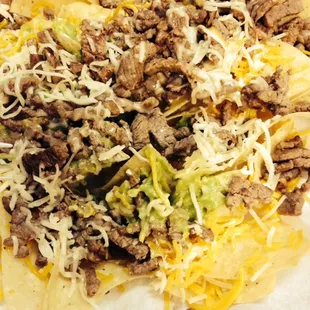Super Nachos - no sour cream and about a tablespoon of guacamole. They are sorely off from their menu photo....