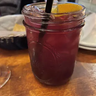 a mason jar with a drink in it