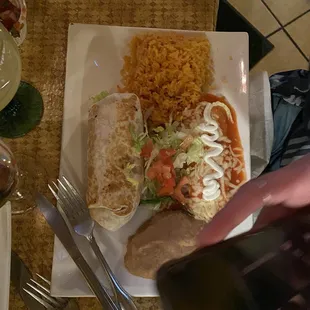 a person taking a picture of a plate of food