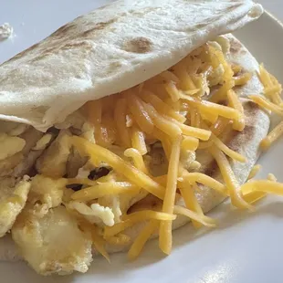 Potato and egg with cheese breakfast taco