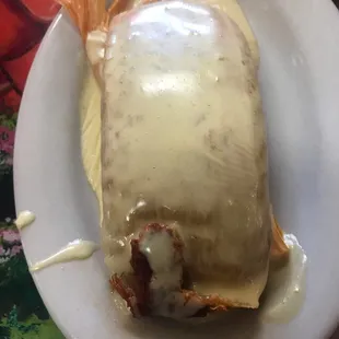 Pork tamale with cheese on top