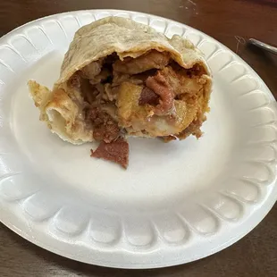 Chorizo, bacon, potatoe, and bean burrito